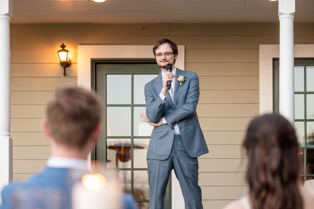 best man on the Vine Hill House porch giving his speech