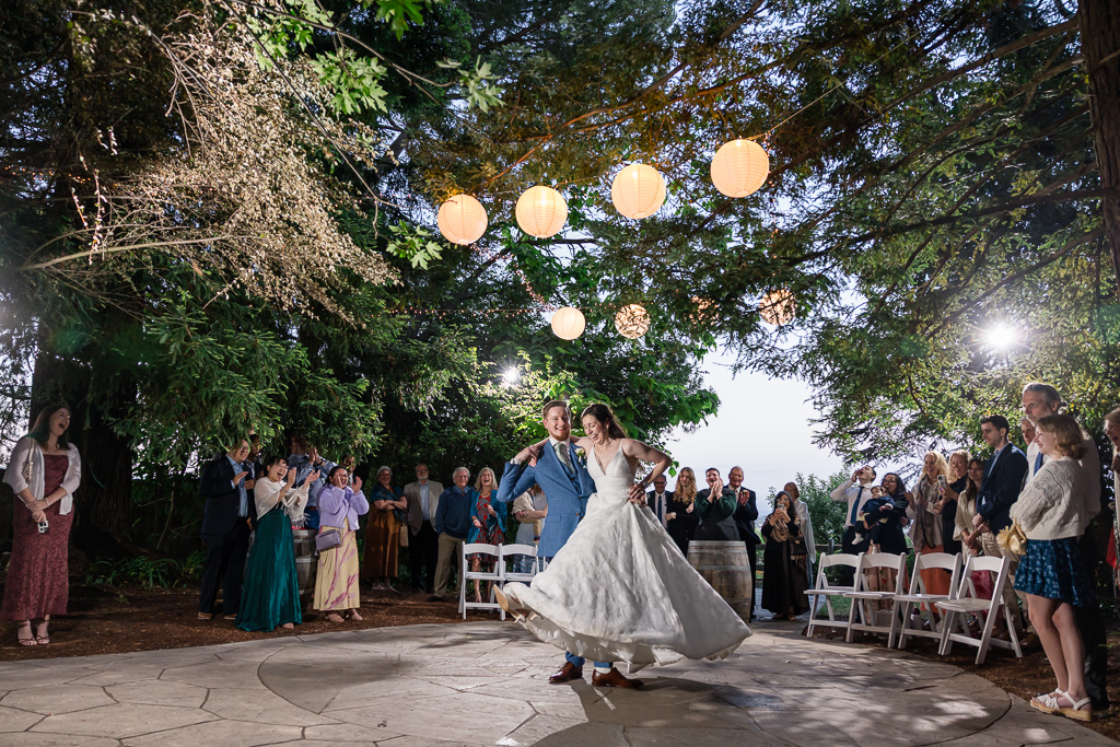 guests gathered around in a circle for first dance at Vine Hill House