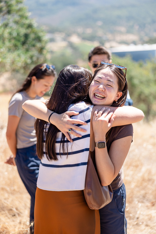 hugging and congratulating