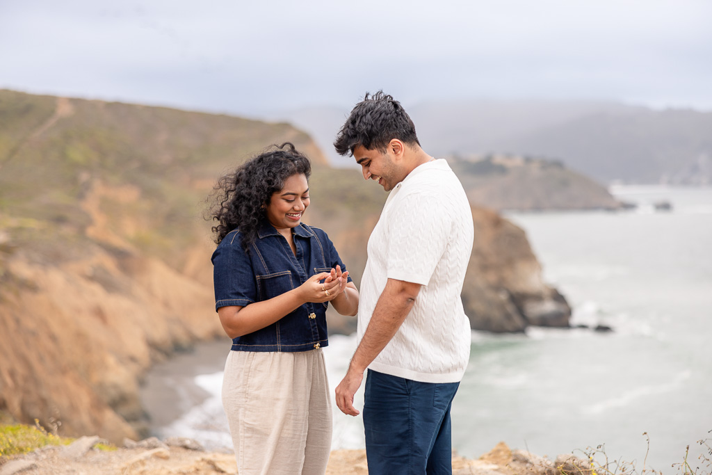 checking out the new ring after proposal