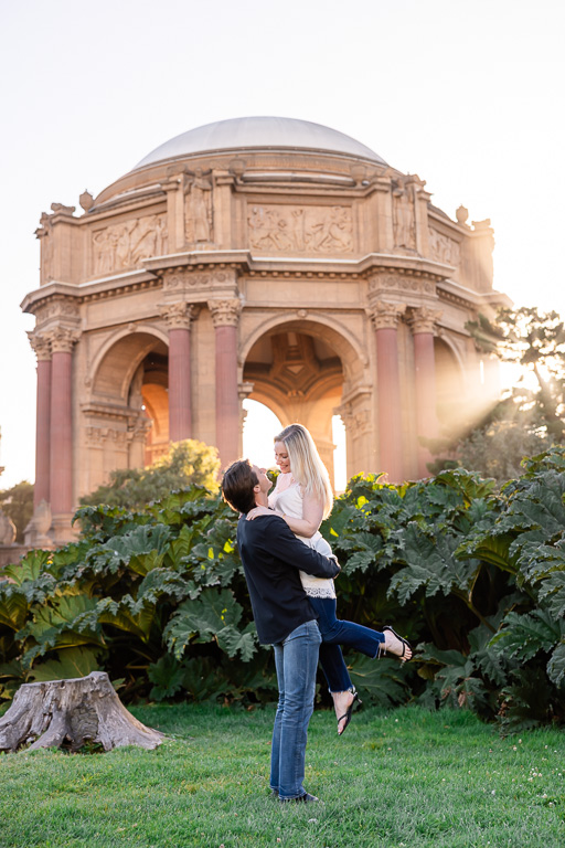engagement photo with epic golden hour light shining through the dome at the Palace of Fine Arts