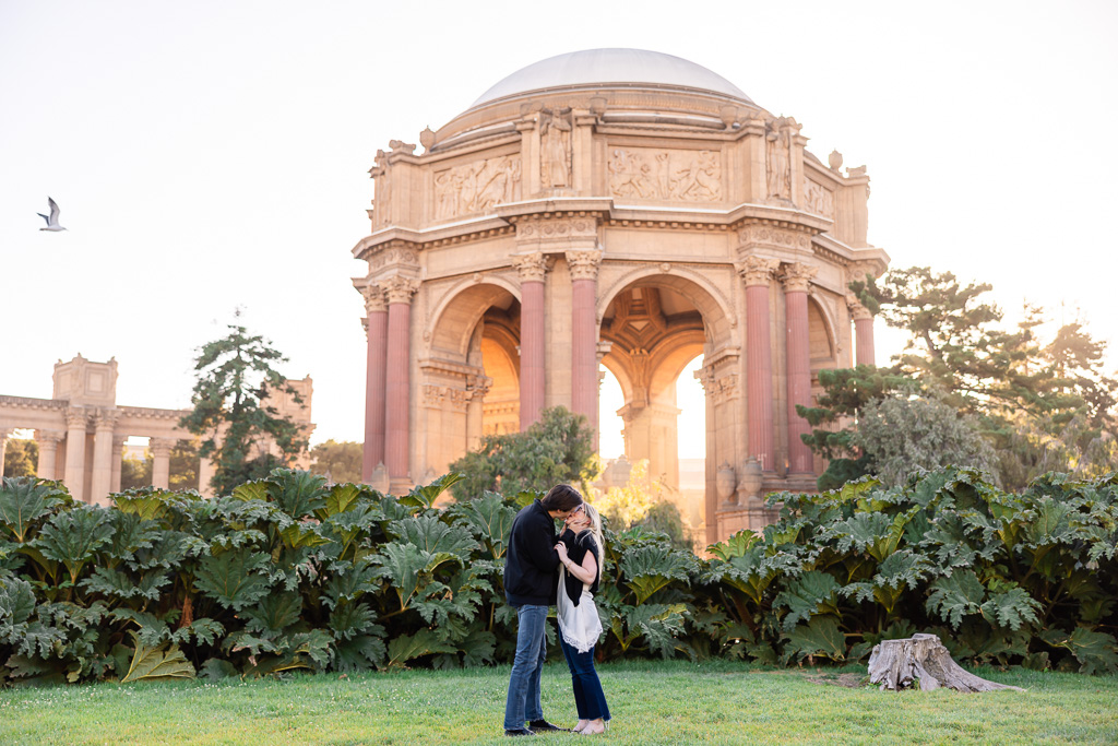 surprise proposal at Palace of Fine Arts golden hour evening glow