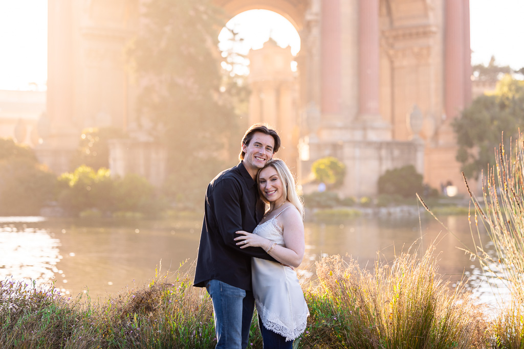 Palace of Fine Arts engagement photos with golden light flooding the scene