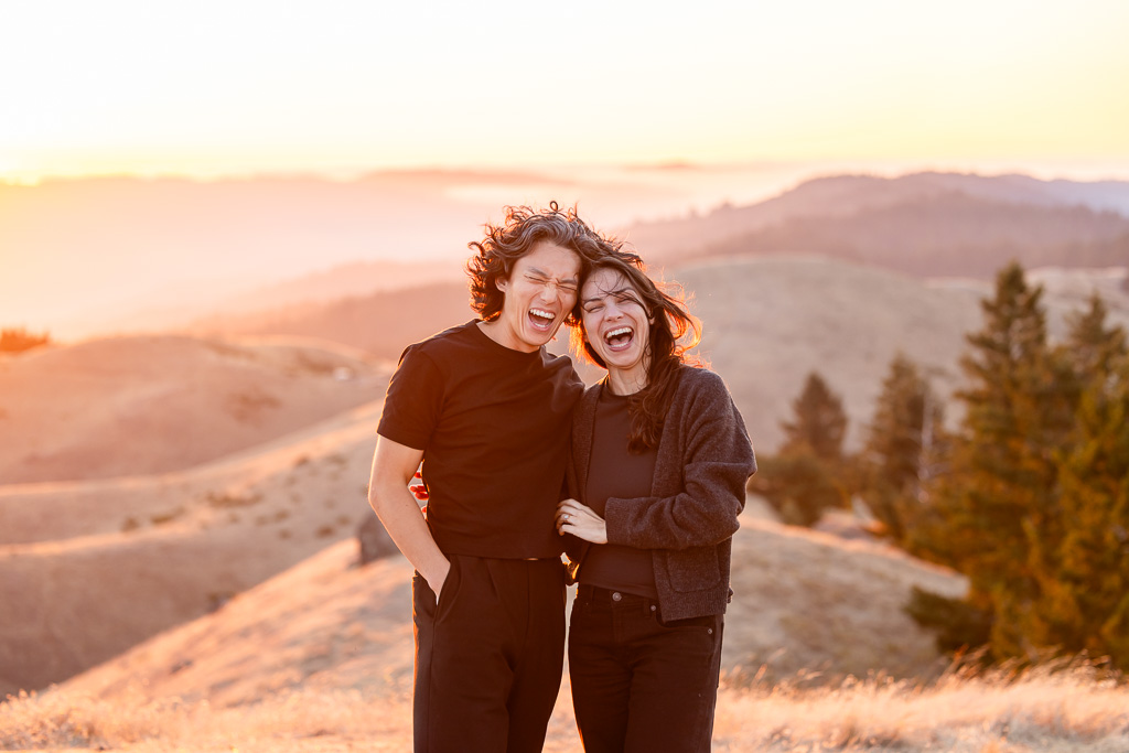 candid and playful photo of couple laughing