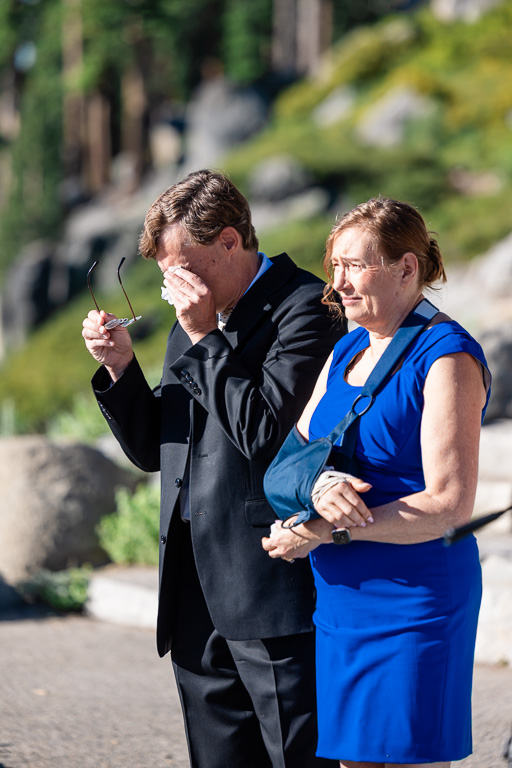 dad wiping away a tear during wedding