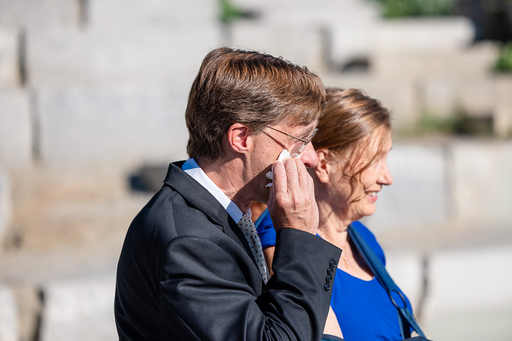 dad wiping away a tear during the wedding ceremony