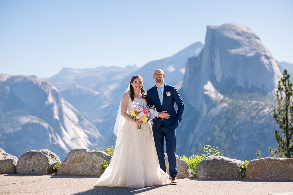 classic posed portraiture of bride and groom at Glacier Point in Yosemite National Park