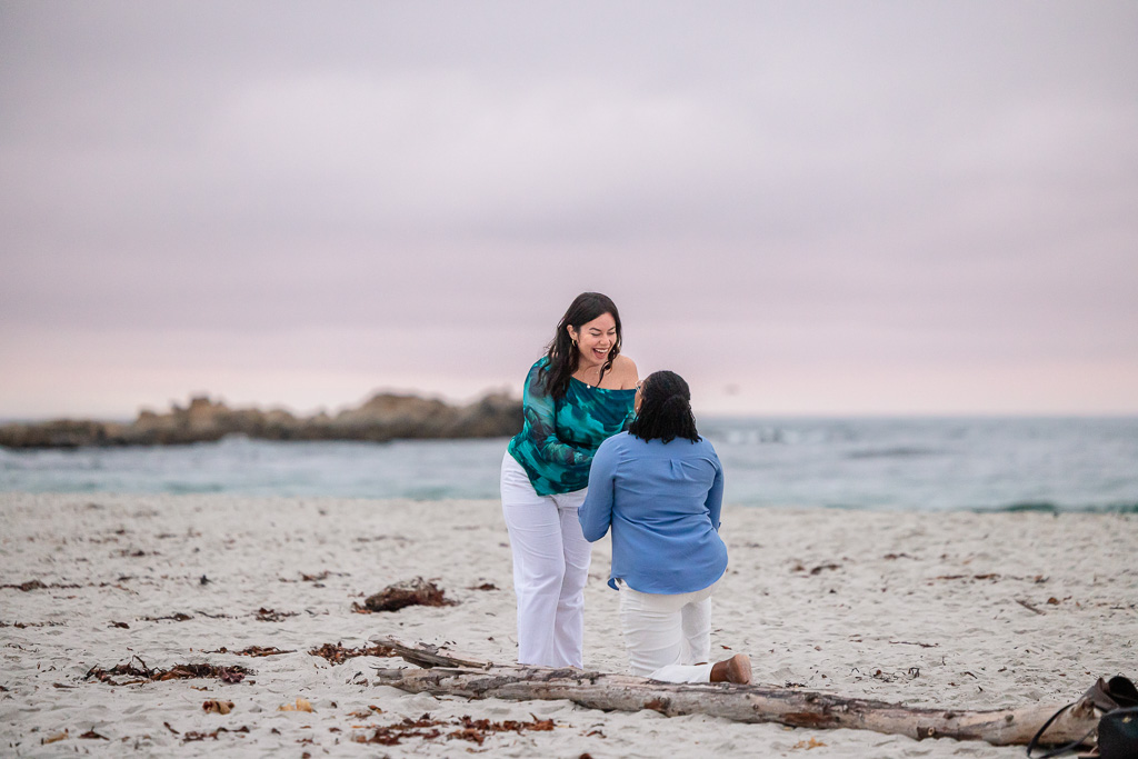 lesbian surprise proposal on the beach in Monterey