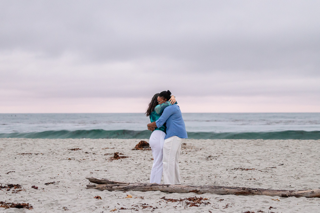couple hugging on the beach