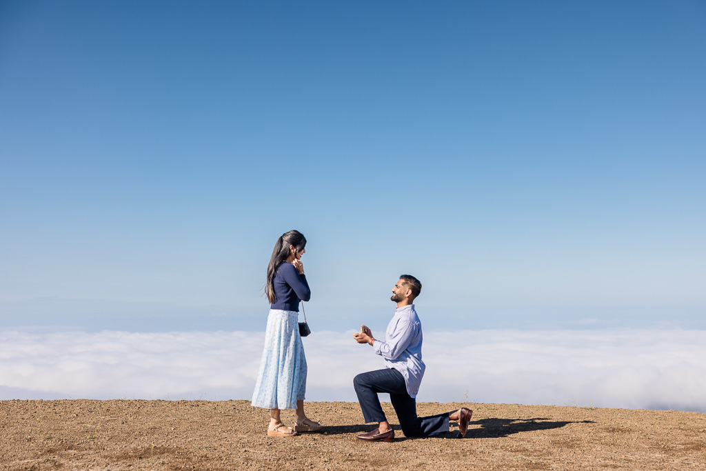 surprise proposal on a clear day with fog down below