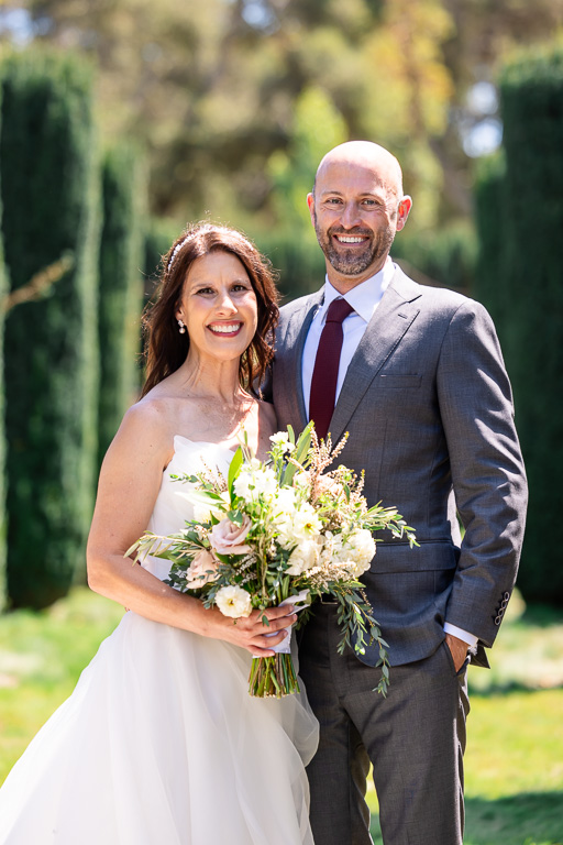 classic wedding portrait looking at the camera