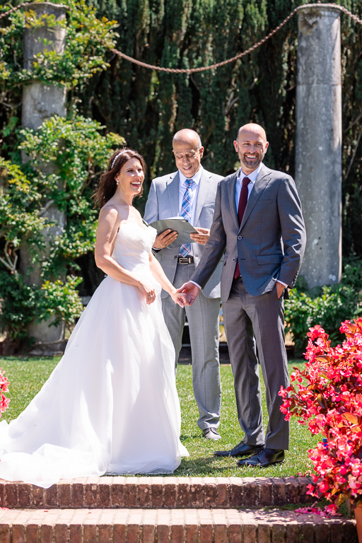 bride and groom looking at their guests during their micro-wedding ceremony