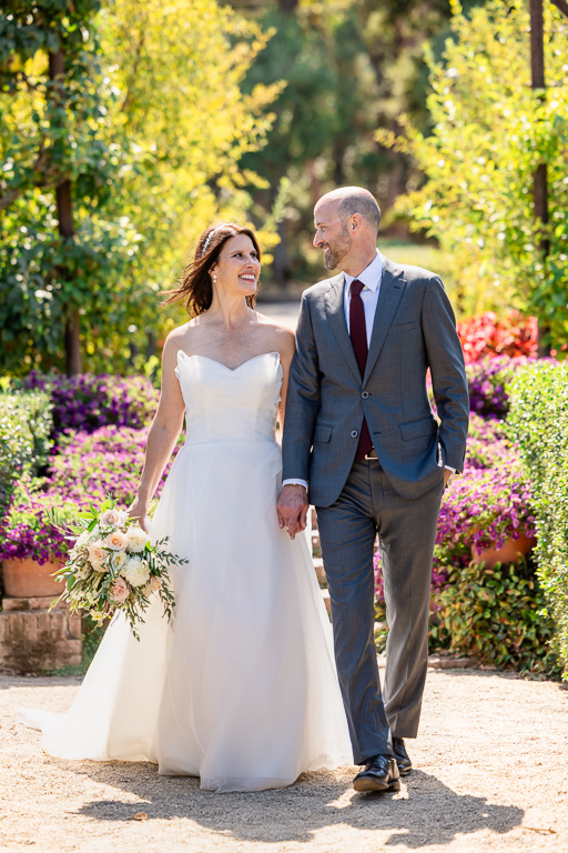 bride and groom walking in the gardens of Filoli