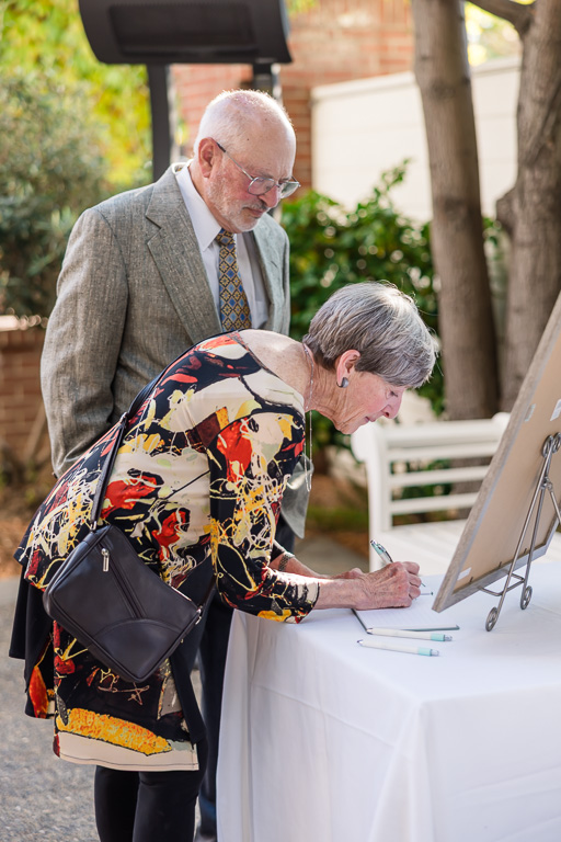 wedding guests signing the sign-in book