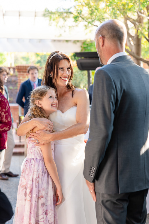 bride and groom greeting a young guest