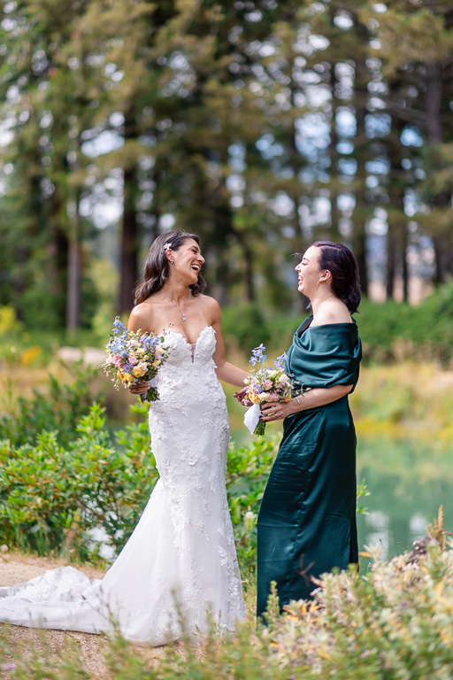 bride and bridesmaid sharing a moment