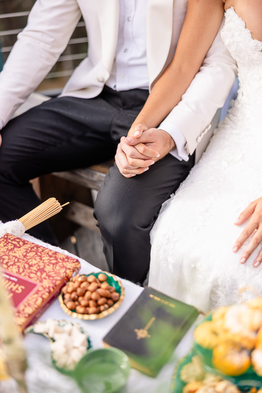 detail photo of the bride and groom together seated for the Sofreh Aghd