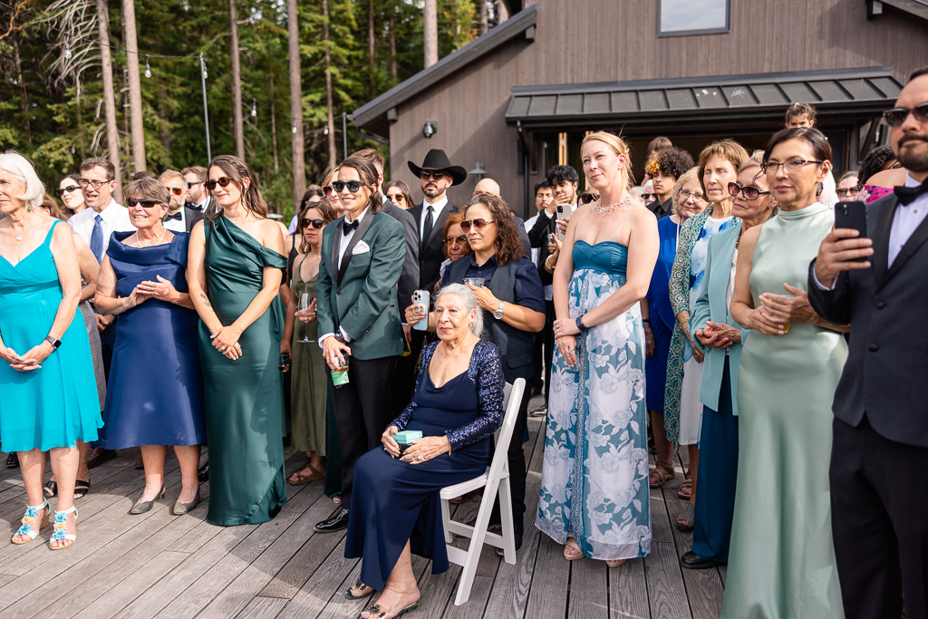 grandma surrounded by other guests watching the Sofreh Aghd ceremony