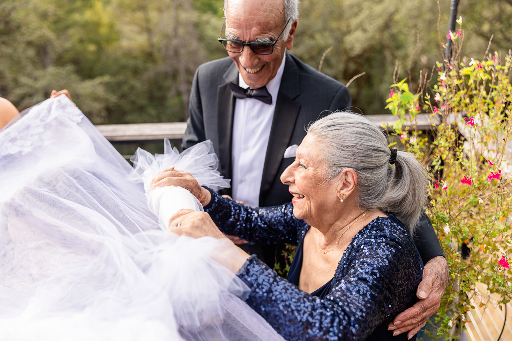 grandmother rubbing the sugar together for the Sofreh Aghd
