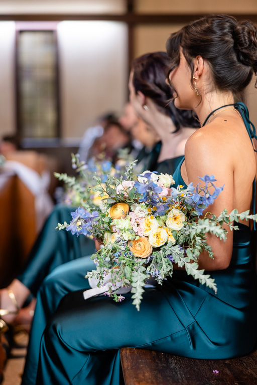 bridesmaids seated at the front of the church