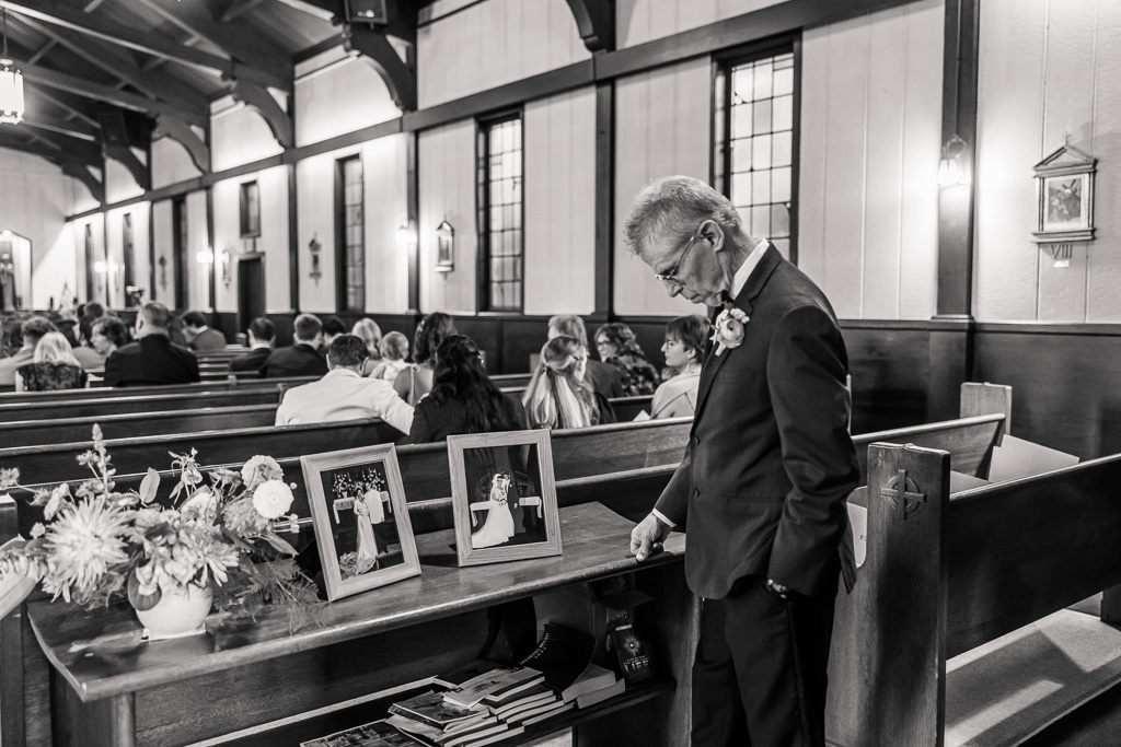 a powerful moment captured at the memorial table of a church wedding