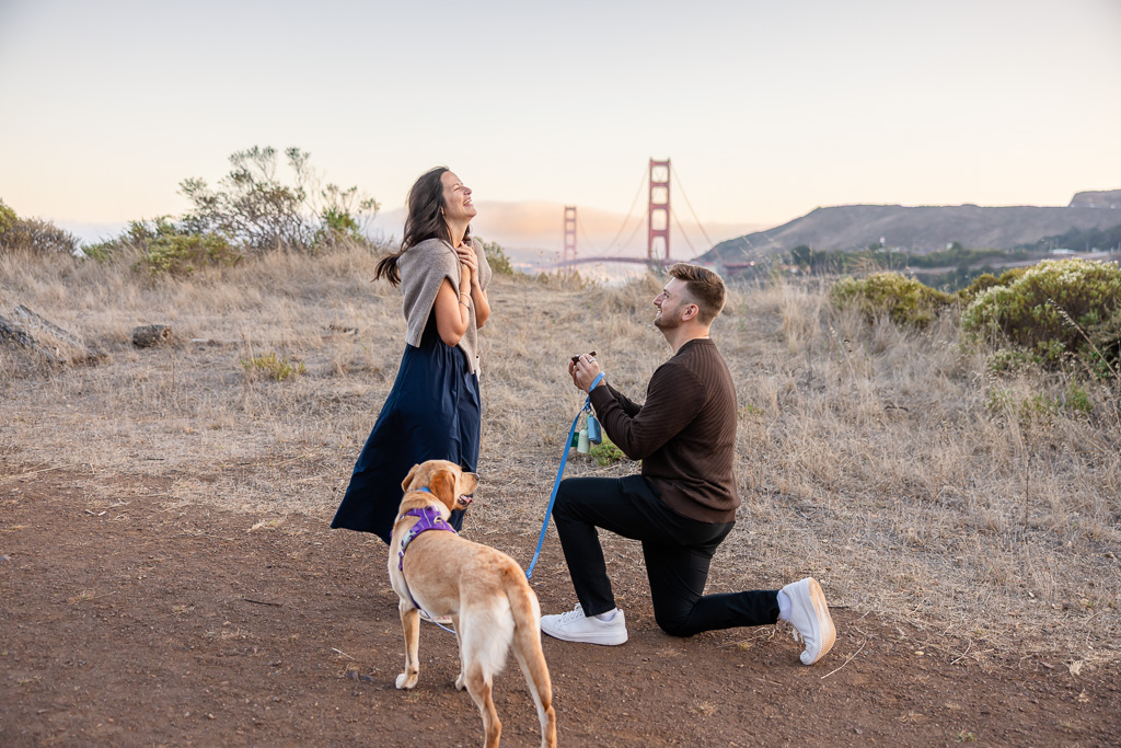 emotional reaction to surprise proposal on a hiking trail above the Golden Gate Bridge