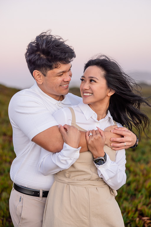 engagement photos at dusk near the ocean