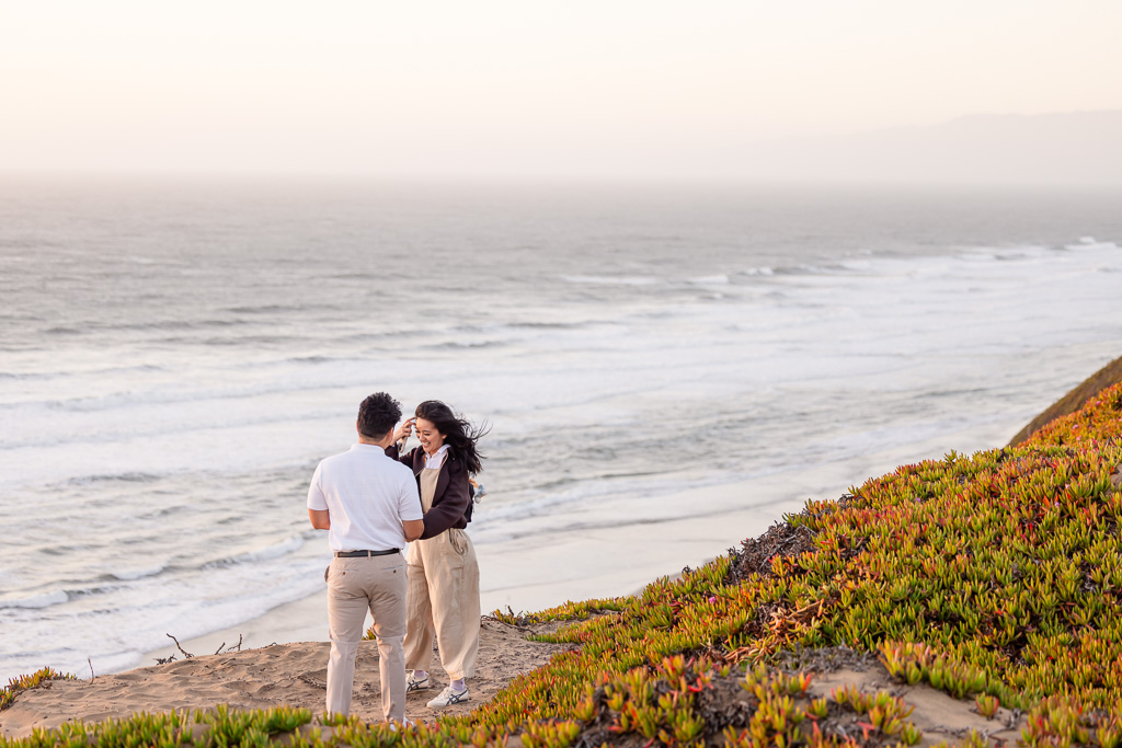 giving proposal speech on ocean cliff side
