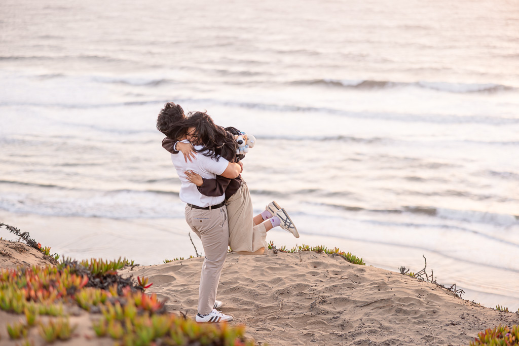being lifted up in excitement right after she said yes to the marriage proposal