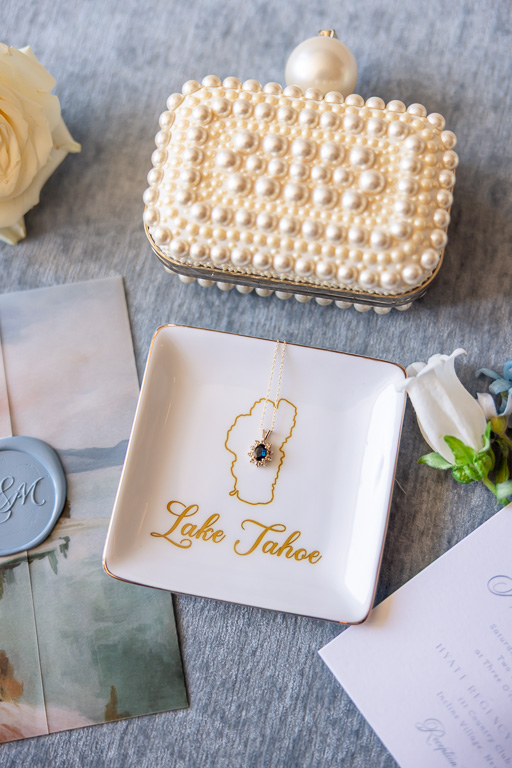 Pearl bridal clutch and necklace arranged with Lake Tahoe wedding details
