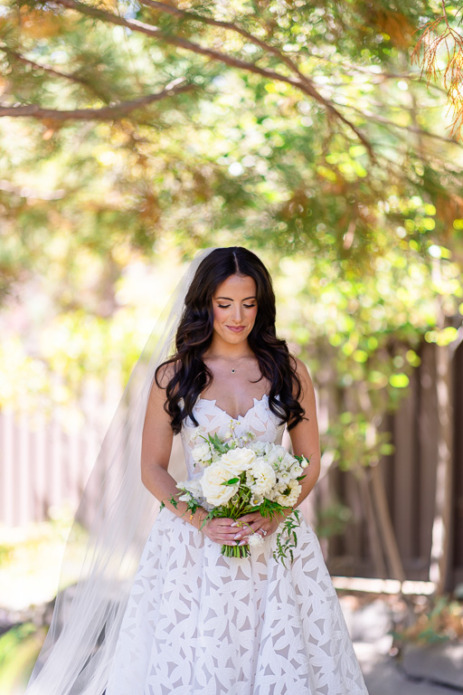 Bride holds her bouquet for an outdoor wedding portrait