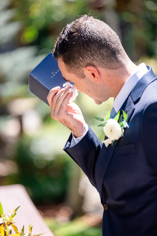 Groom pauses to compose himself during an emotional first touch moment