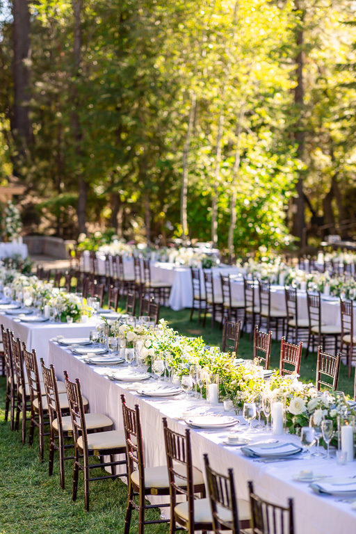 Outdoor wedding reception tables set beneath the pines at Hyatt Regency Lake Tahoe Resort