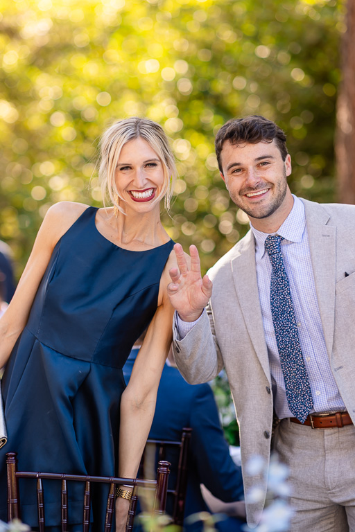 Woman and man smile together at the outdoor wedding reception