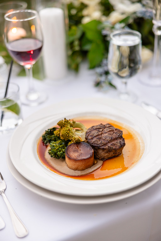 Dinner and wine are served at the wedding reception