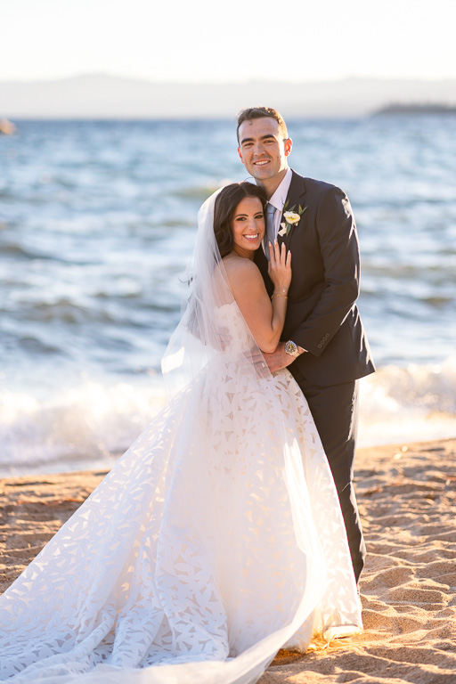 Couple poses together on the Lake Tahoe shoreline