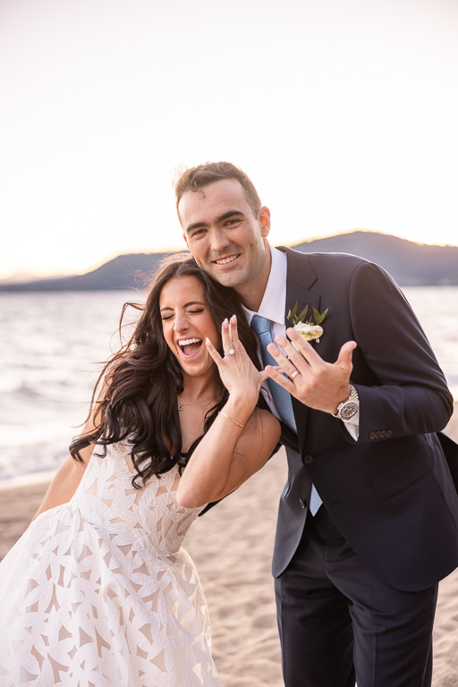 Bride and groom pose together for a wedding portrait beside Lake Tahoe