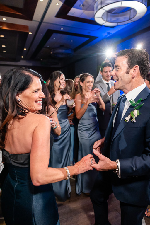 parents of the bride dancing together on the reception floor