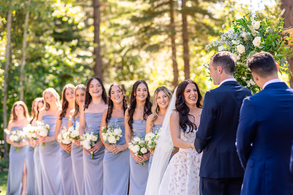 Bride flanked by her bridesmaids in lavender dresses