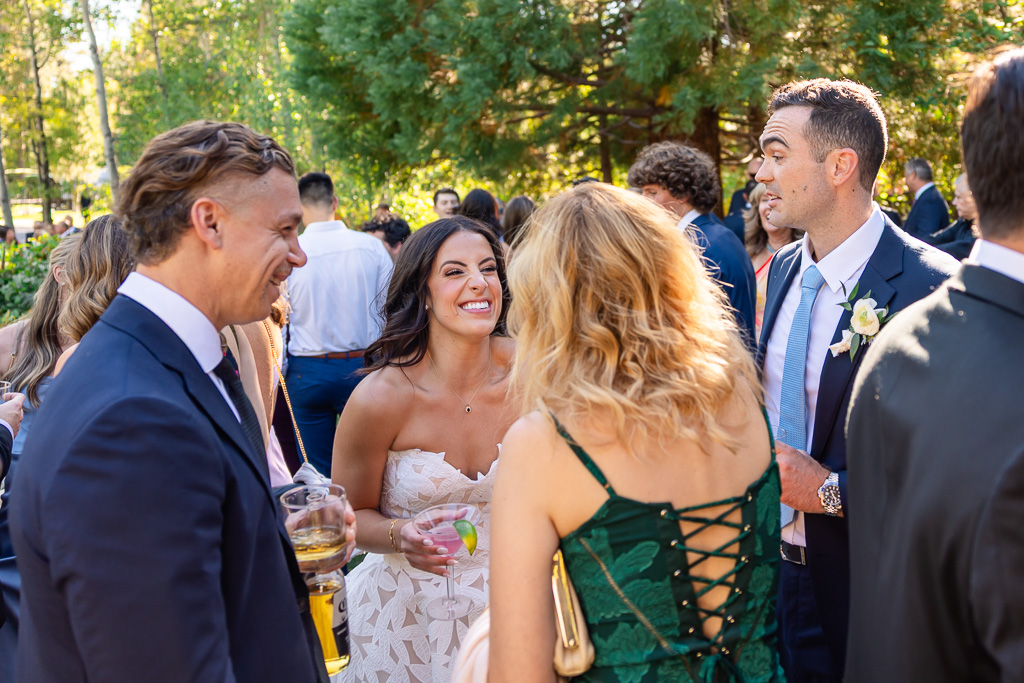 Bride and groom greet guests at the outdoor reception at Hyatt Regency Lake Tahoe Resort