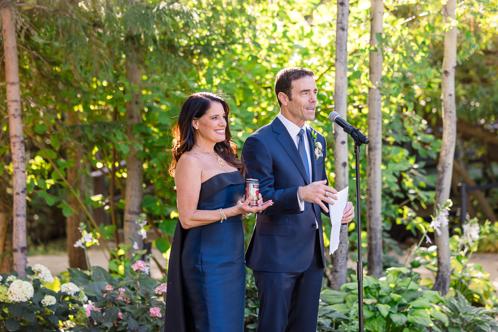 parents of the bride giving a welcome speech at the reception
