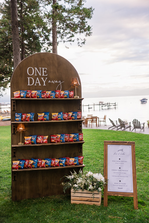 Chips arranged on a snack shelf beneath a “One Day Away” sign.