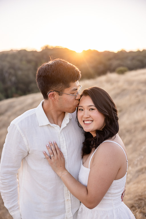 sunset engagement photos with sun flare