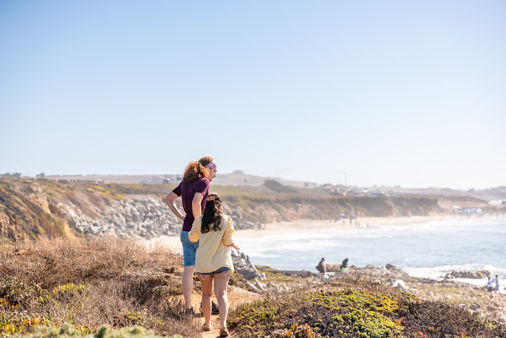 couple walking up to a spot at the beach overlook
